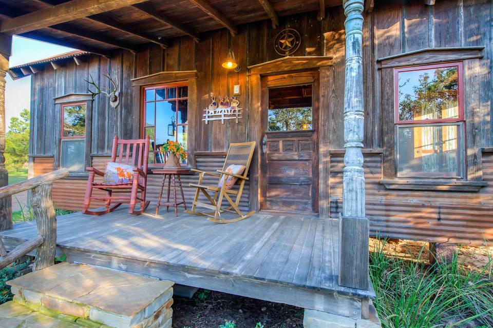 The rustic Cowboy Cabin was built from salvaged materials. The 12'x28' cabin has 2 sleeping lofts. | www.facebook.com/SmallHouseBliss