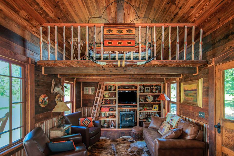 The rustic Cowboy Cabin was built from salvaged materials. The 12'x28' cabin has 2 sleeping lofts. | www.facebook.com/SmallHouseBliss