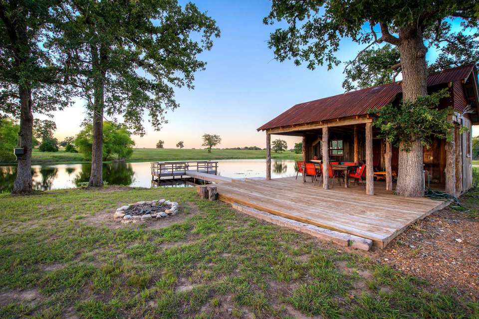 The rustic Cowboy Cabin was built from salvaged materials. The 12'x28' cabin has 2 sleeping lofts. | www.facebook.com/SmallHouseBliss