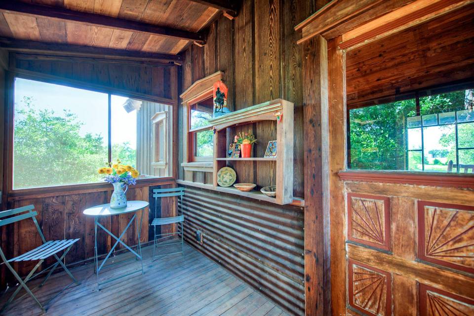 The rustic Cowboy Cabin was built from salvaged materials. The 12'x28' cabin has 2 sleeping lofts. | www.facebook.com/SmallHouseBliss