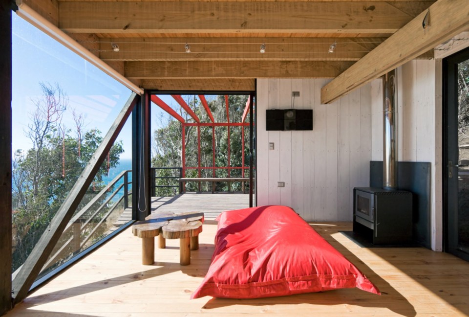 A low-cost "surf shack" cabin overlooking the ocean in Chile. Shared by two brothers, it has two small bedrooms in 555 sq ft. | www.facebook.com/SmallHouseBliss