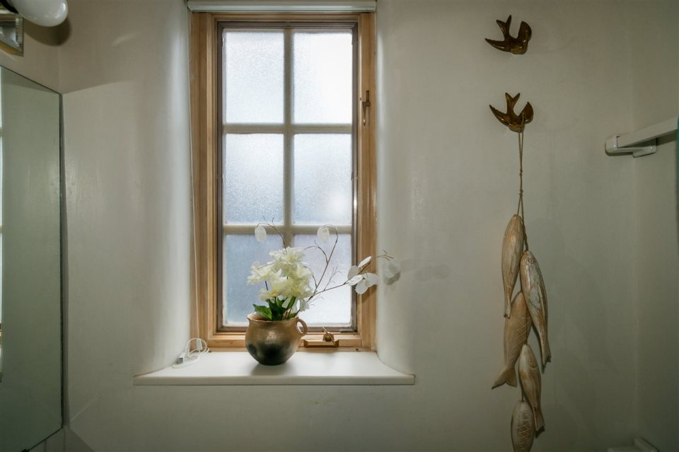 A 1930s Pueblo Revival style adobe home retrofitted with a rooftop active solar system. It is 510 sq ft with a loft bedroom. | www.facebook.com/SmallHouseBliss