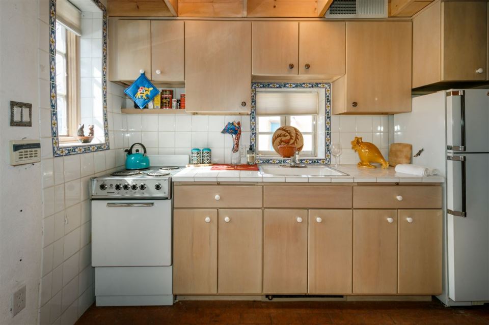 A 1930s Pueblo Revival style adobe home retrofitted with a rooftop active solar system. It is 510 sq ft with a loft bedroom. | www.facebook.com/SmallHouseBliss