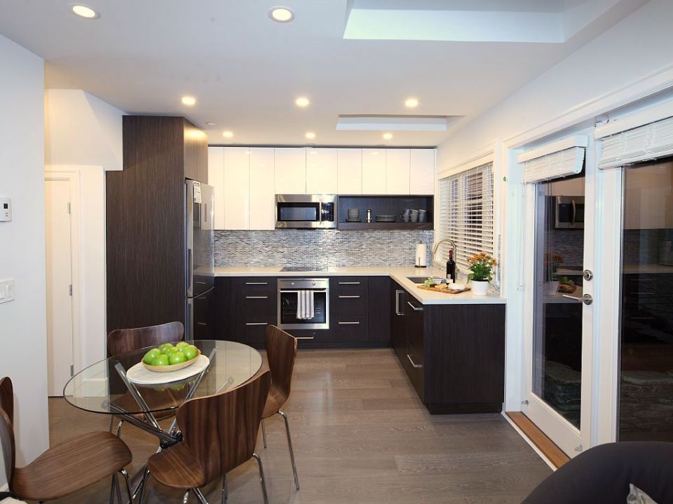 Buttercup Guest House, a 780 sq ft backyard cottage with a bedroom and bathroom on both floors. | www.facebook.com/SmallHouseBliss