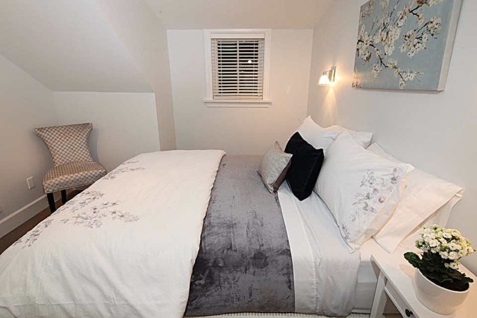 Buttercup Guest House, a 780 sq ft backyard cottage with a bedroom and bathroom on both floors. | www.facebook.com/SmallHouseBliss