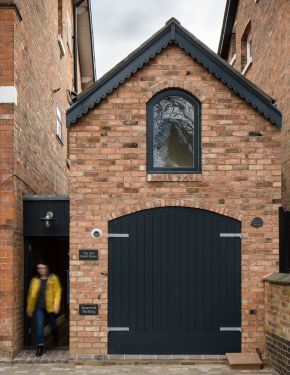 This Victorian-era brick coach house was converted into an inspiring home and studio for a writer. | www.facebook.com/SmallHouseBliss