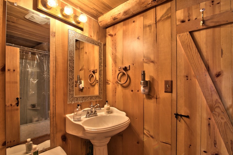 This saddle-notched log cabin was built in 1929 on Lake Tahoe. It has a 475 sq ft footprint plus a loft bedroom. | www.facebook.com/SmallHouseBliss