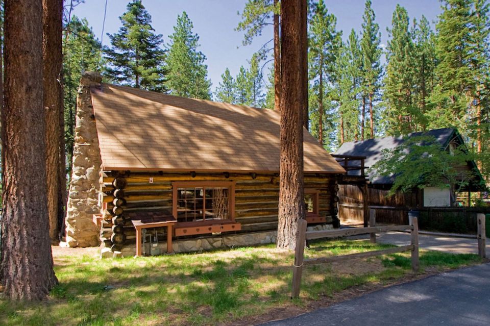This saddle-notched log cabin was built in 1929 on Lake Tahoe. It has a 475 sq ft footprint plus a loft bedroom. | www.facebook.com/SmallHouseBliss