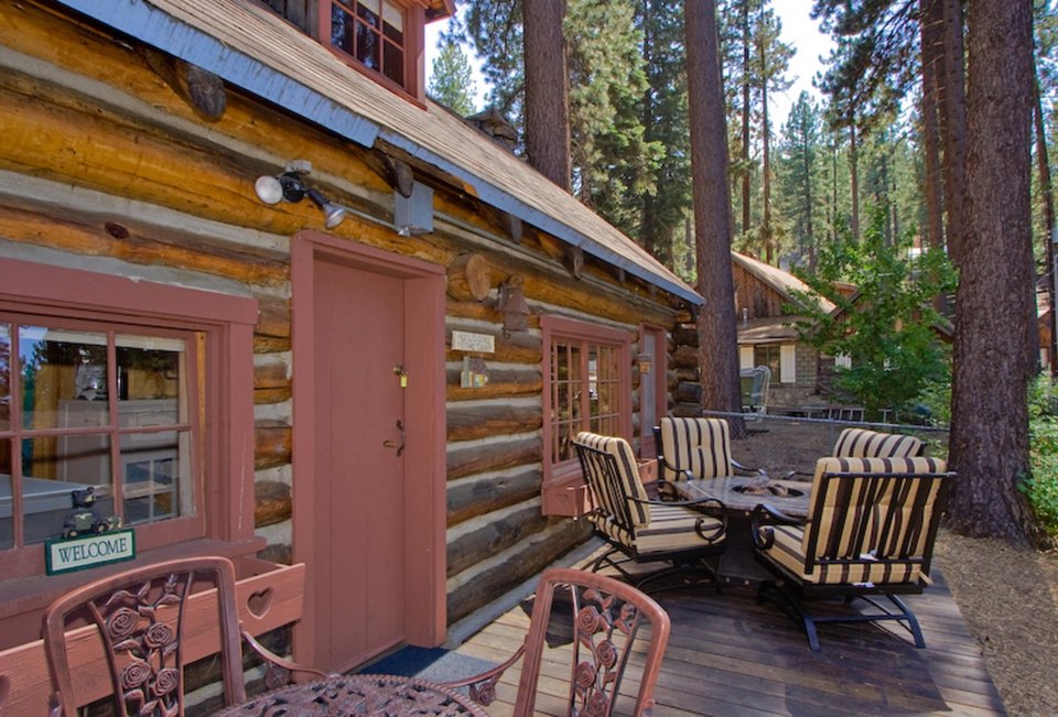 This saddle-notched log cabin was built in 1929 on Lake Tahoe. It has a 475 sq ft footprint plus a loft bedroom. | www.facebook.com/SmallHouseBliss
