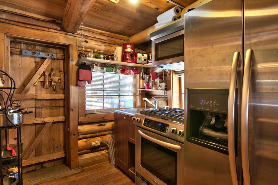 This saddle-notched log cabin was built in 1929 on Lake Tahoe. It has a 475 sq ft footprint plus a loft bedroom. | www.facebook.com/SmallHouseBliss