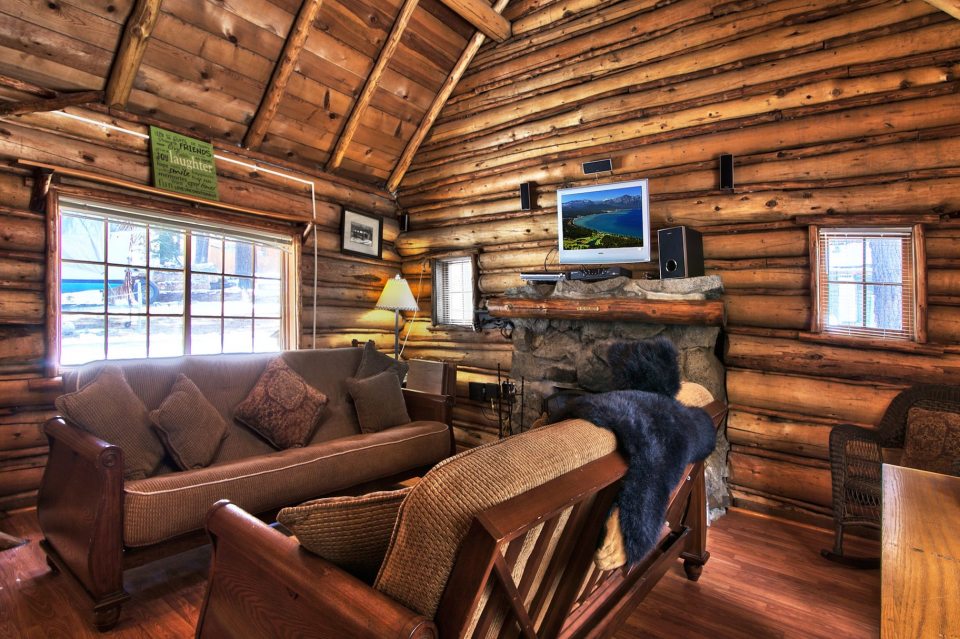 This saddle-notched log cabin was built in 1929 on Lake Tahoe. It has a 475 sq ft footprint plus a loft bedroom. | www.facebook.com/SmallHouseBliss