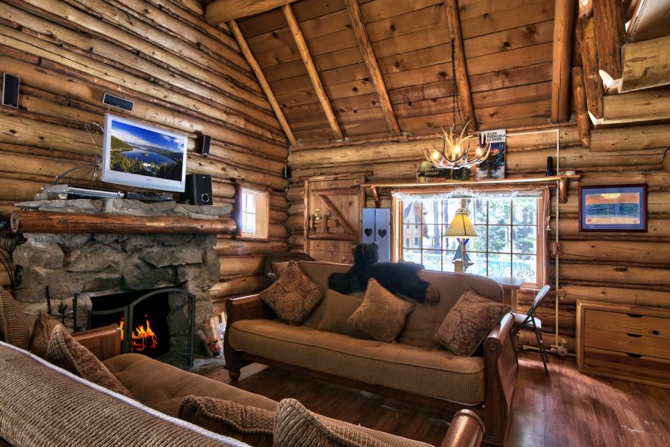This saddle-notched log cabin was built in 1929 on Lake Tahoe. It has a 475 sq ft footprint plus a loft bedroom. | www.facebook.com/SmallHouseBliss