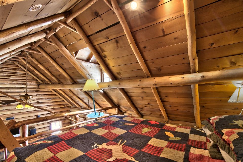 This saddle-notched log cabin was built in 1929 on Lake Tahoe. It has a 475 sq ft footprint plus a loft bedroom. | www.facebook.com/SmallHouseBliss