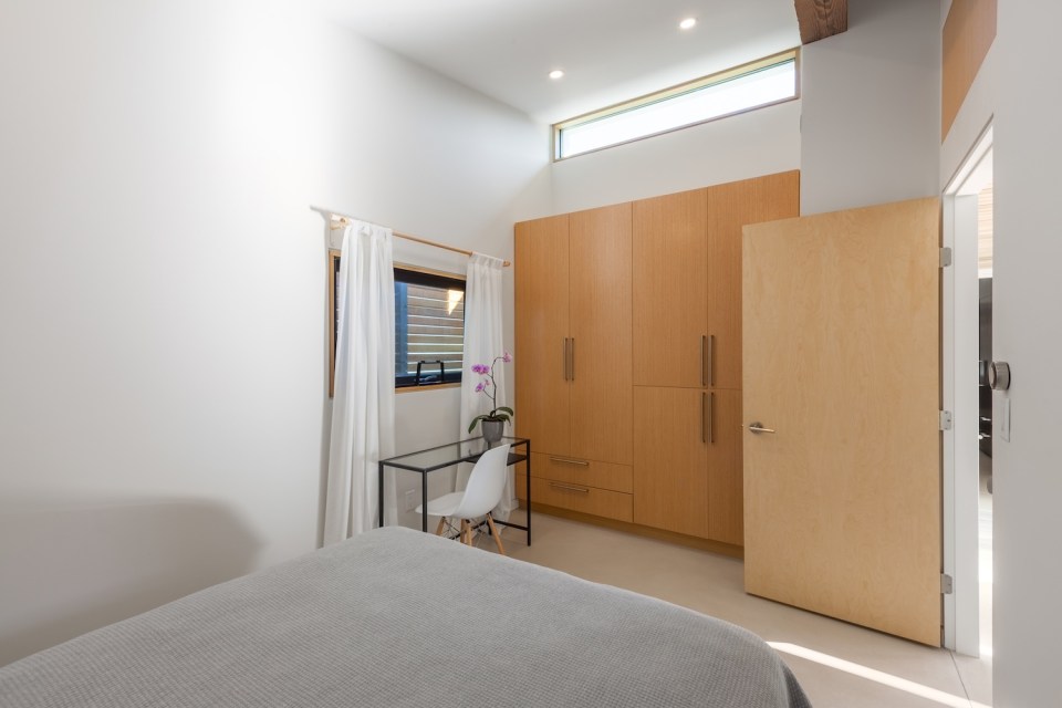 The Two Birds laneway house, an energy-efficient modern home with two bedrooms in a 940 sq ft single-level plan. | www.facebook.com/SmallHouseBliss