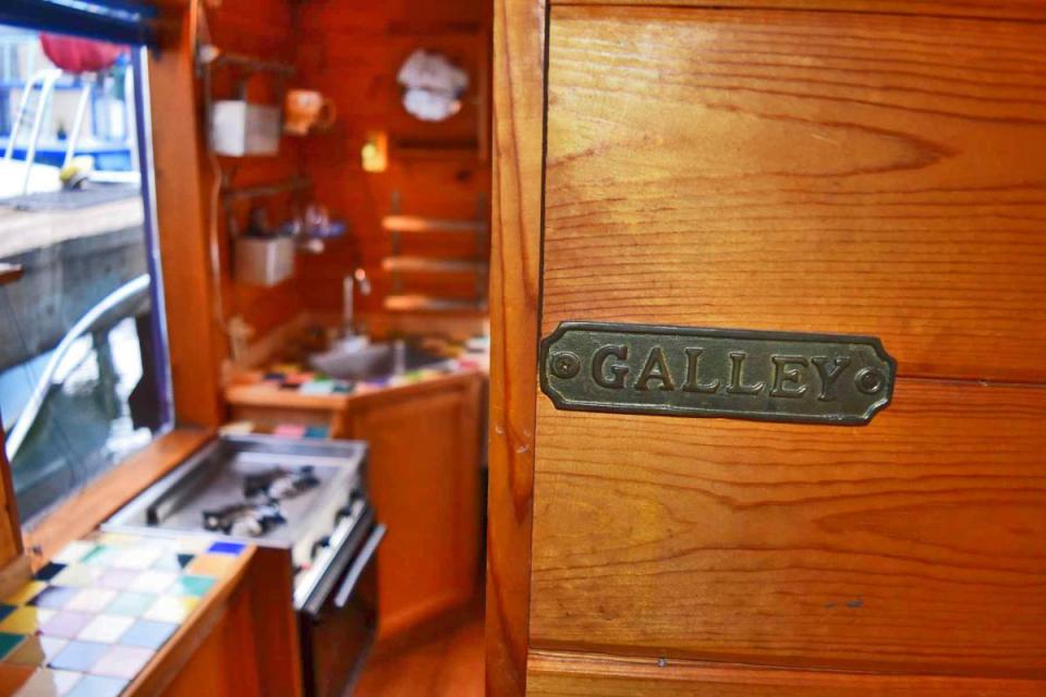 "Tao", a tiny houseboat on Seattle's Lake Union. Tao has roughly 260 sq ft of inside space plus a sleeping loft. | www.facebook.com/SmallHouseBliss