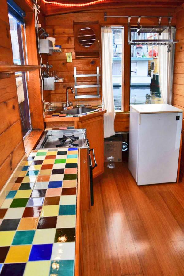 "Tao", a tiny houseboat on Seattle's Lake Union. Tao has roughly 260 sq ft of inside space plus a sleeping loft. | www.facebook.com/SmallHouseBliss