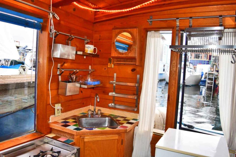 "Tao", a tiny houseboat on Seattle's Lake Union. Tao has roughly 260 sq ft of inside space plus a sleeping loft. | www.facebook.com/SmallHouseBliss