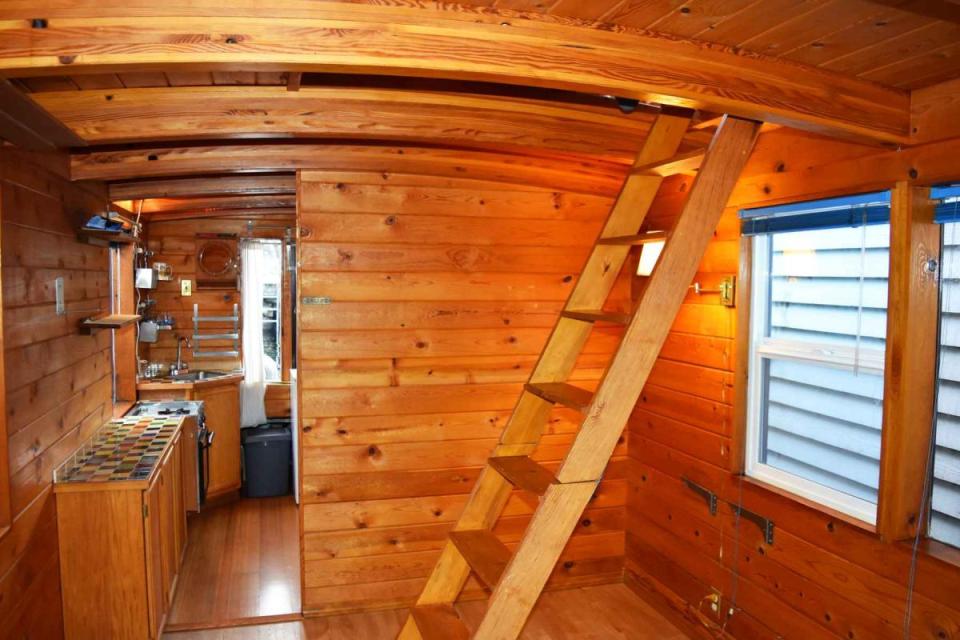 "Tao", a tiny houseboat on Seattle's Lake Union. Tao has roughly 260 sq ft of inside space plus a sleeping loft. | www.facebook.com/SmallHouseBliss