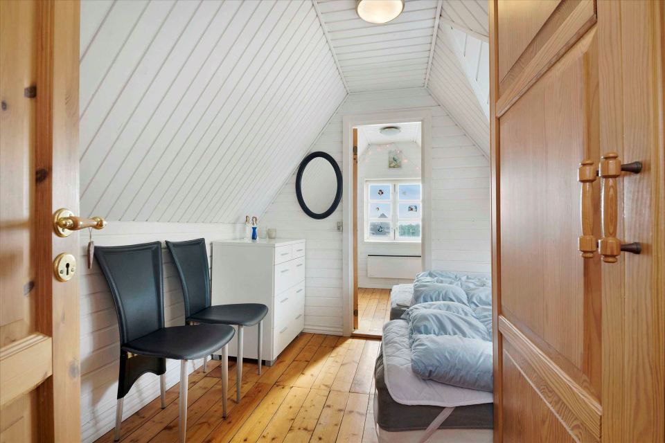 This 80-year-old thatched cottage in Denmark sits in the coastal dunes by the North Sea. It has two bedrooms in 753 sq ft. | www.facebook.com/SmallHouseBliss