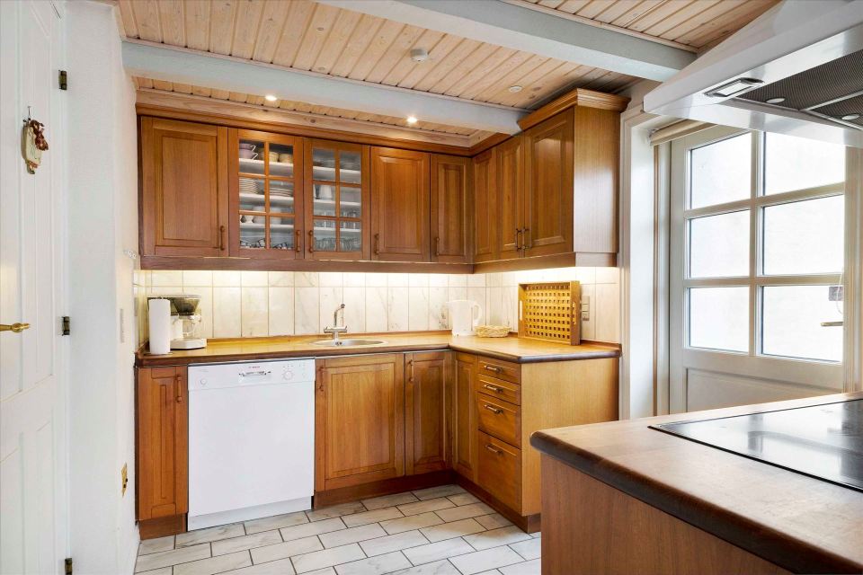 This 80-year-old thatched cottage in Denmark sits in the coastal dunes by the North Sea. It has two bedrooms in 753 sq ft. | www.facebook.com/SmallHouseBliss