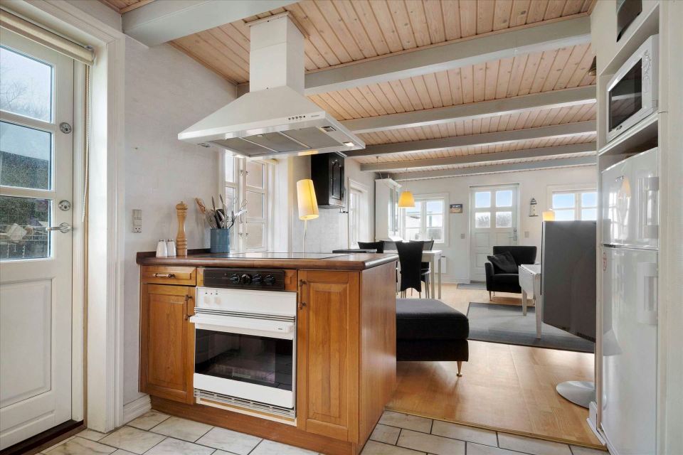 This 80-year-old thatched cottage in Denmark sits in the coastal dunes by the North Sea. It has two bedrooms in 753 sq ft. | www.facebook.com/SmallHouseBliss