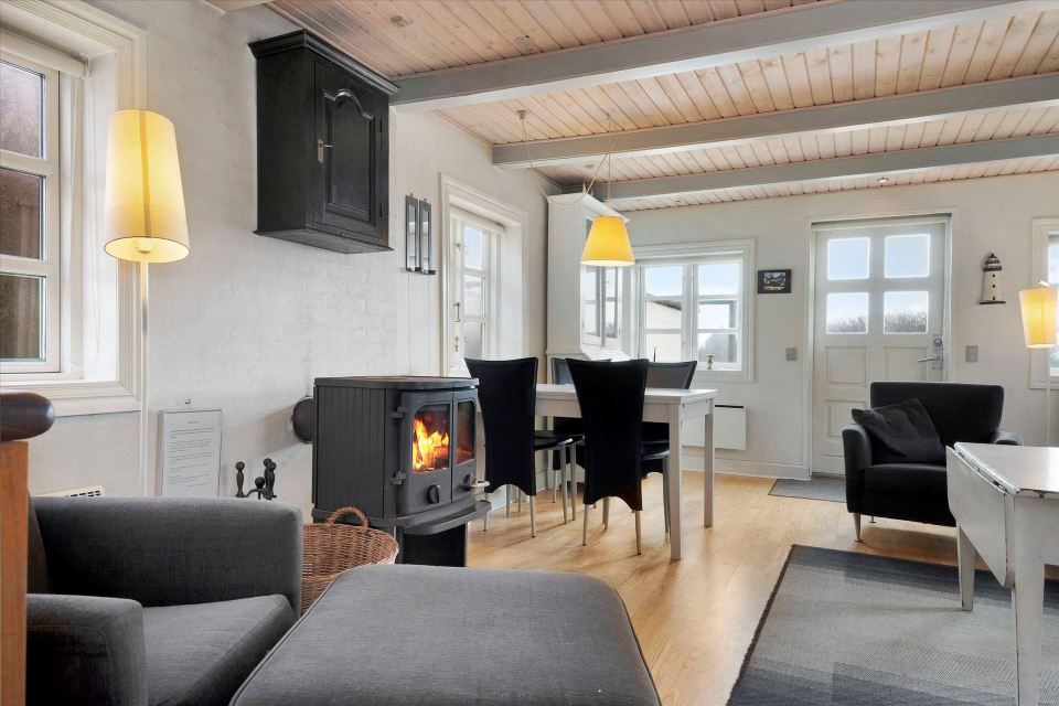 This 80-year-old thatched cottage in Denmark sits in the coastal dunes by the North Sea. It has two bedrooms in 753 sq ft. | www.facebook.com/SmallHouseBliss