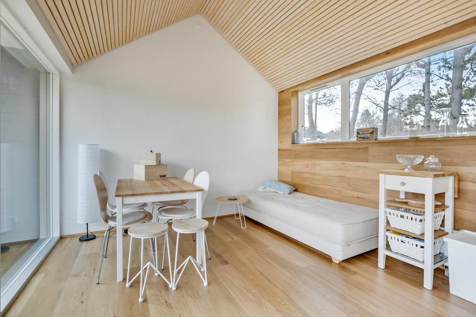 This Scandinavian Modern tiny house in Denmark has a 258 sq ft studio floor plan with sleeping loft. | www.facebook.com/SmallHouseBliss