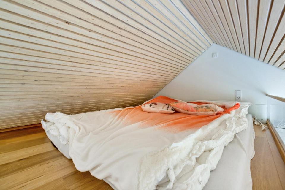 This Scandinavian Modern tiny house in Denmark has a 258 sq ft studio floor plan with sleeping loft. | www.facebook.com/SmallHouseBliss