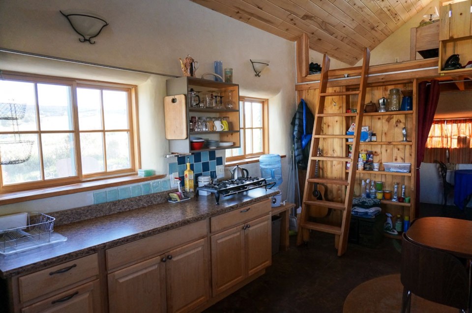 This small straw bale house is off the grid on 40 acres of Colorado pasture, forest and canyon. It has one bedroom on the 468 sq ft ground floor plus a loft. | www.facebook.com/SmallHouseBliss