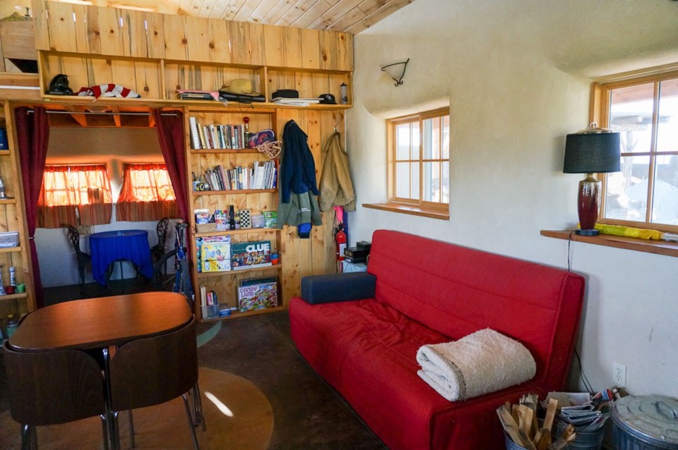 This small straw bale house is off the grid on 40 acres of Colorado pasture, forest and canyon. It has one bedroom on the 468 sq ft ground floor plus a loft. | www.facebook.com/SmallHouseBliss
