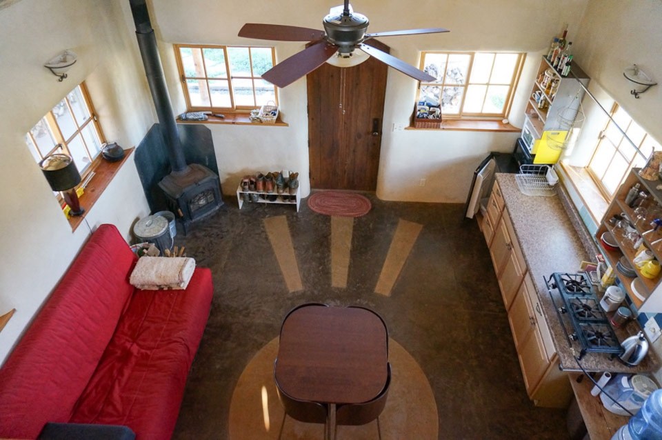 This small straw bale house is off the grid on 40 acres of Colorado pasture, forest and canyon. It has one bedroom on the 468 sq ft ground floor plus a loft. | www.facebook.com/SmallHouseBliss