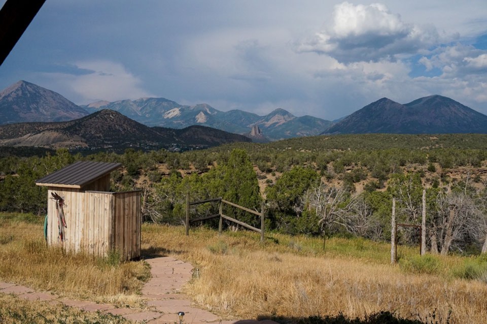 This small straw bale house is off the grid on 40 acres of Colorado pasture, forest and canyon. It has one bedroom on the 468 sq ft ground floor plus a loft. | www.facebook.com/SmallHouseBliss