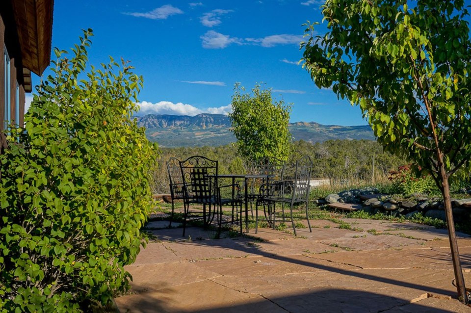 This small straw bale house is off the grid on 40 acres of Colorado pasture, forest and canyon. It has one bedroom on the 468 sq ft ground floor plus a loft. | www.facebook.com/SmallHouseBliss