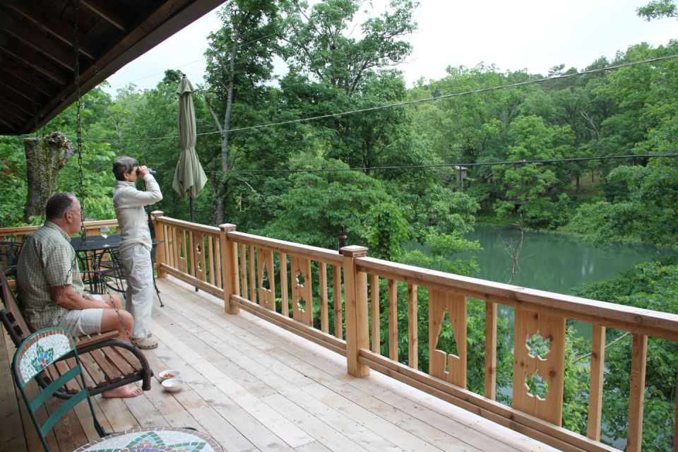 The Perch, a 1920s log cabin resembling a forest fire lookout tower. It has one bedroom in roughly 600 sq ft. | www.facebook.com/SmallHouseBliss