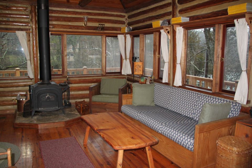 The Perch, a 1920s log cabin resembling a forest fire lookout tower. It has one bedroom in roughly 600 sq ft. | www.facebook.com/SmallHouseBliss