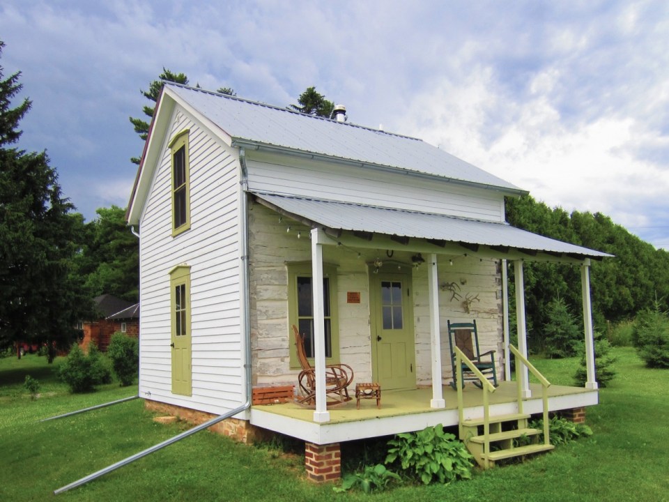 Trout River Log Cabin is over 150 years old. Originally a school, it has twice been disassembled, moved and put back together. | www.facebook.com/SmallHouseBliss