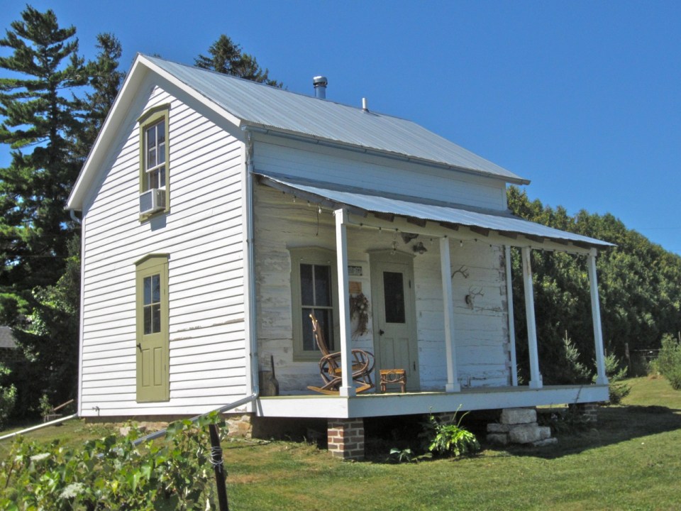 Trout River Log Cabin is over 150 years old. Originally a school, it has twice been disassembled, moved and put back together. | www.facebook.com/SmallHouseBliss