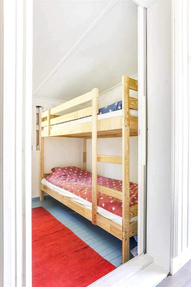 This 1930 summer cottage in Sweden retains its original vintage charm. It has two small bedrooms in 592 sq ft. | www.facebook.com/SmallHouseBliss