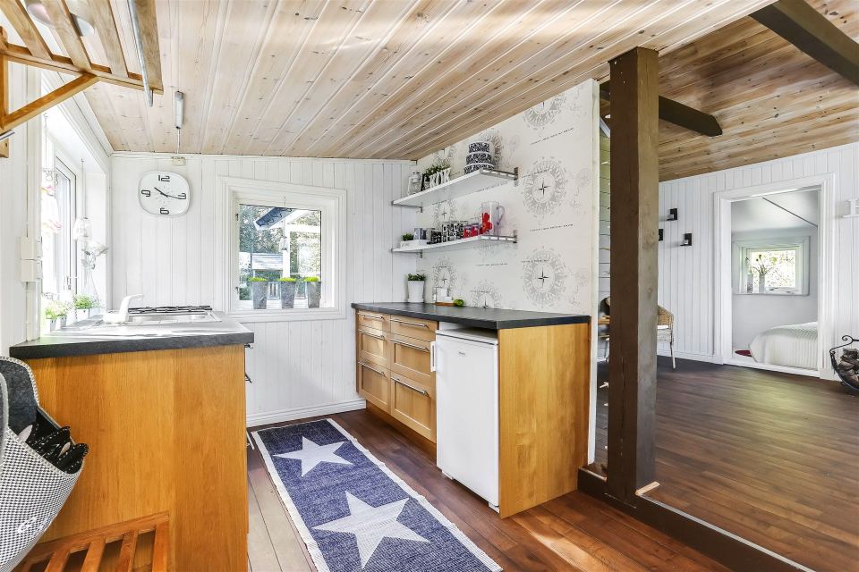 This 1930 summer cottage in Sweden retains its original vintage charm. It has two small bedrooms in 592 sq ft. | www.facebook.com/SmallHouseBliss