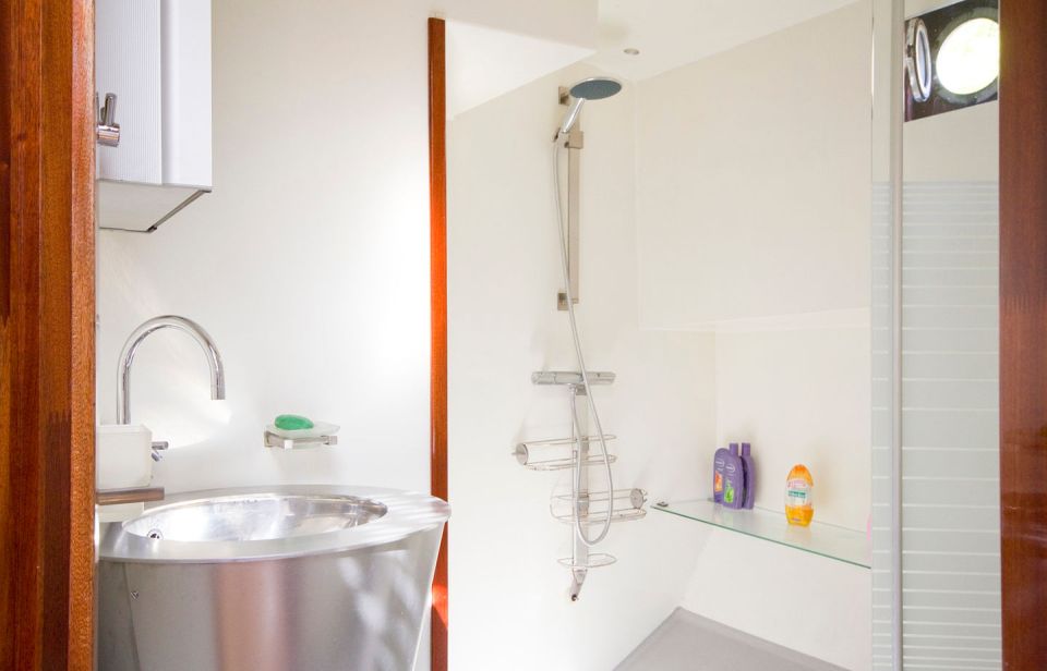 A canal barge built in 1908 was converted into this comfortable two-bedroom houseboat in Amsterdam. | www.facebook.com/SmallHouseBliss