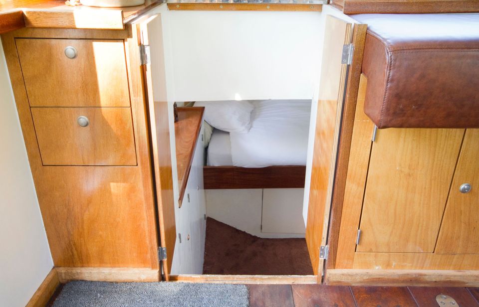 A canal barge built in 1908 was converted into this comfortable two-bedroom houseboat in Amsterdam. | www.facebook.com/SmallHouseBliss