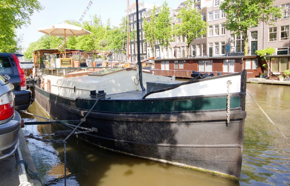 A canal barge built in 1908 was converted into this comfortable two-bedroom houseboat in Amsterdam. | www.facebook.com/SmallHouseBliss