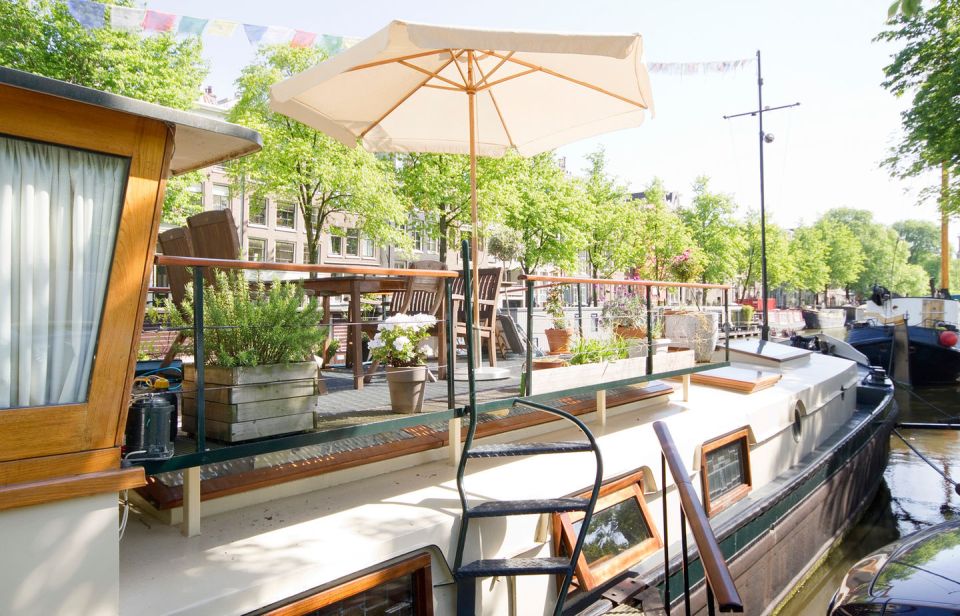 A canal barge built in 1908 was converted into this comfortable two-bedroom houseboat in Amsterdam. | www.facebook.com/SmallHouseBliss