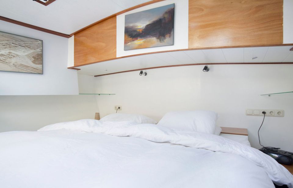 A canal barge built in 1908 was converted into this comfortable two-bedroom houseboat in Amsterdam. | www.facebook.com/SmallHouseBliss