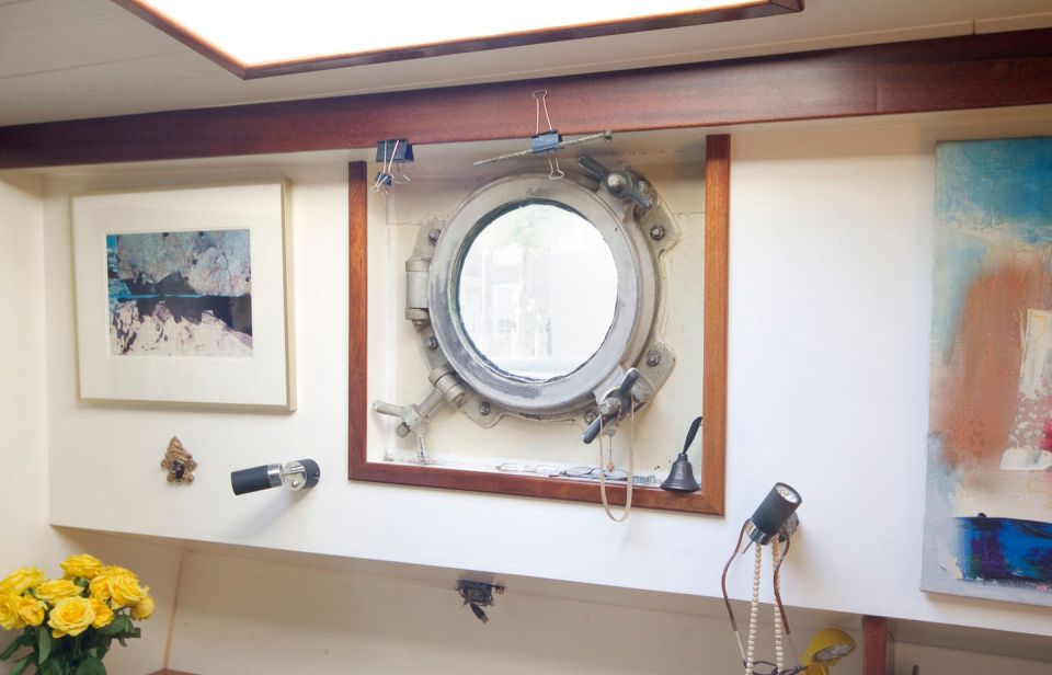 A canal barge built in 1908 was converted into this comfortable two-bedroom houseboat in Amsterdam. | www.facebook.com/SmallHouseBliss