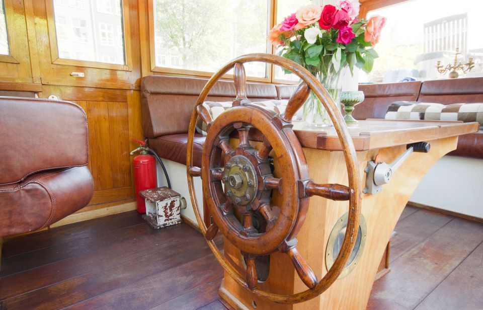 A canal barge built in 1908 was converted into this comfortable two-bedroom houseboat in Amsterdam. | www.facebook.com/SmallHouseBliss
