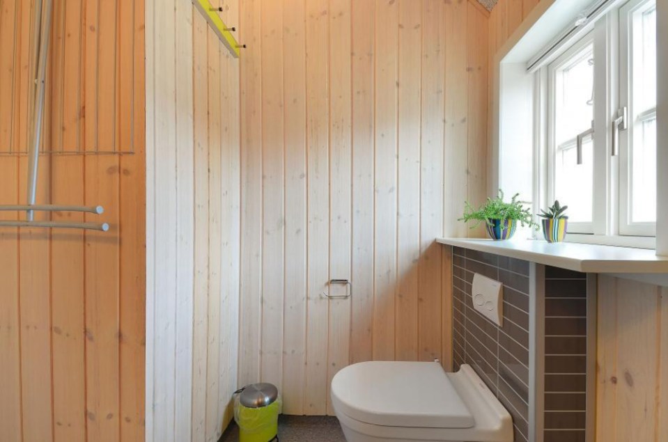 This Danish summerhouse was inspired by the neighboring fishermen's sheds. It has one bedroom on the 375 sq ft ground floor, plus a sleeping loft. | www.facebook.com/SmallHouseBliss