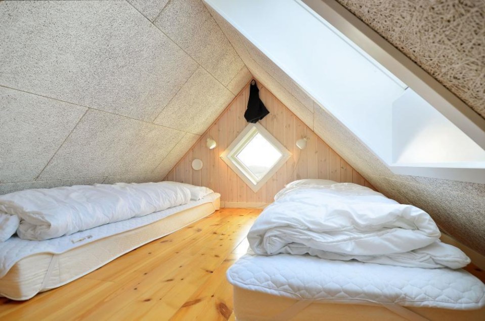 This Danish summerhouse was inspired by the neighboring fishermen's sheds. It has one bedroom on the 375 sq ft ground floor, plus a sleeping loft. | www.facebook.com/SmallHouseBliss