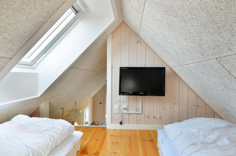 This Danish summerhouse was inspired by the neighboring fishermen's sheds. It has one bedroom on the 375 sq ft ground floor, plus a sleeping loft. | www.facebook.com/SmallHouseBliss