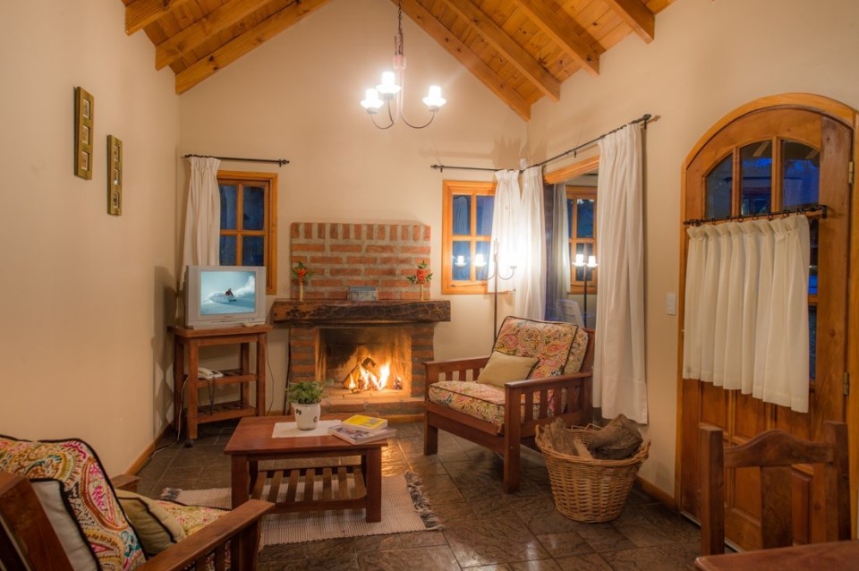 These Alpine-style brick and wood cottages in Patagonia offer one bedroom in a 786 sq ft single-level plan. | www.facebook.com/SmallHouseBliss